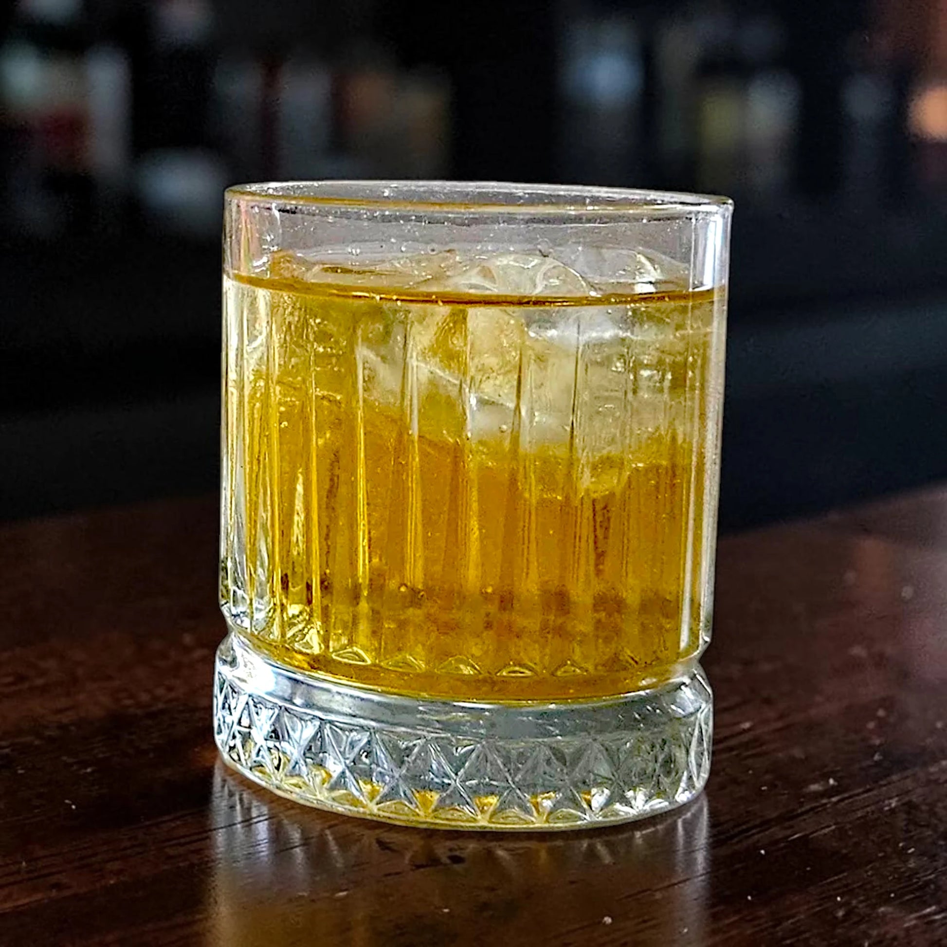 Strange Cane OG spiced rum in a glass with ginger ale