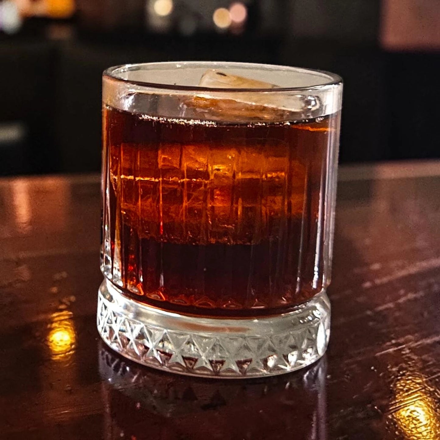 Strange Cane OG spiced rum served with cola