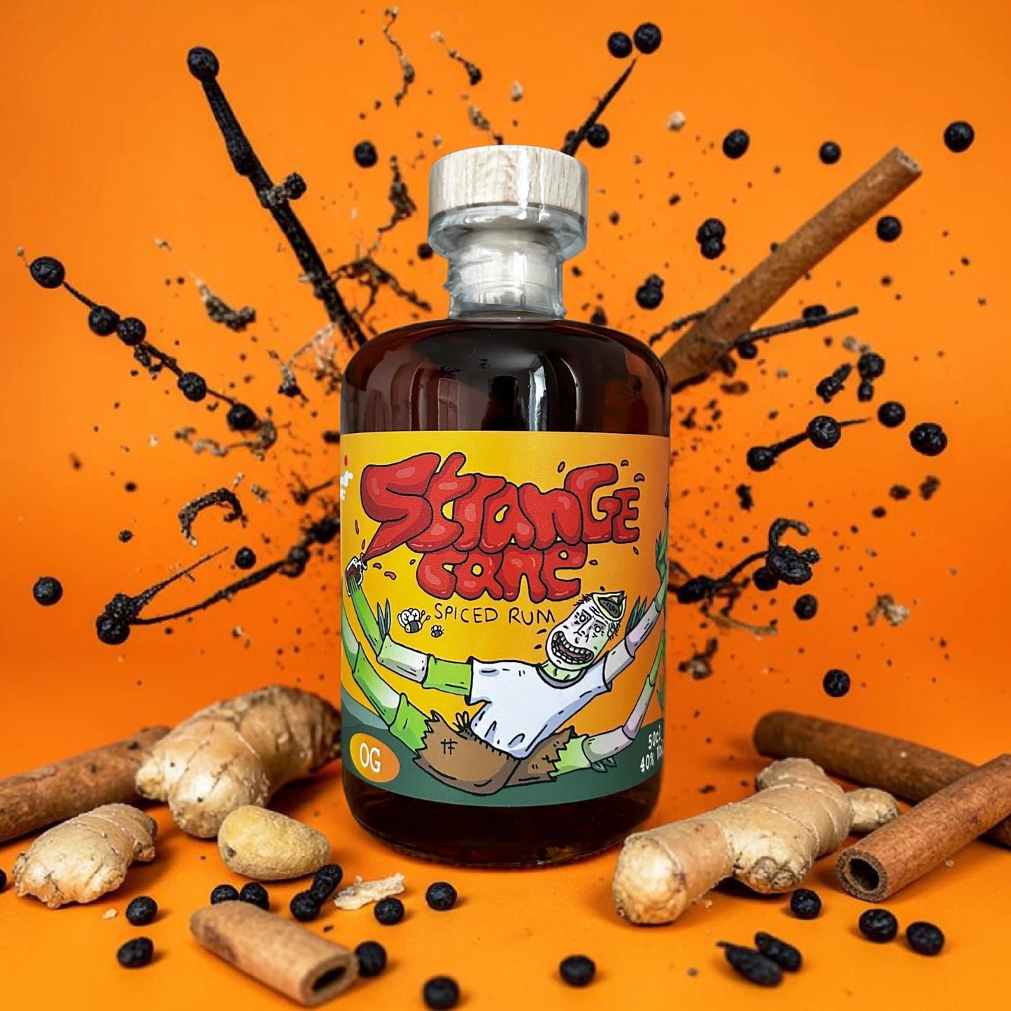 The OG Strange Cane spiced rum on vibrant orange background with an explosion of flavours, including cinnamon, ginger, and vanilla