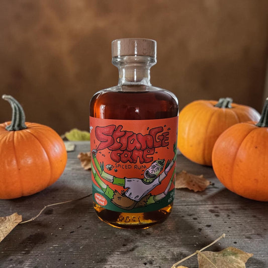 A bottle of Pumpkin Spiced Strange Cane spiced rum with pumpkins