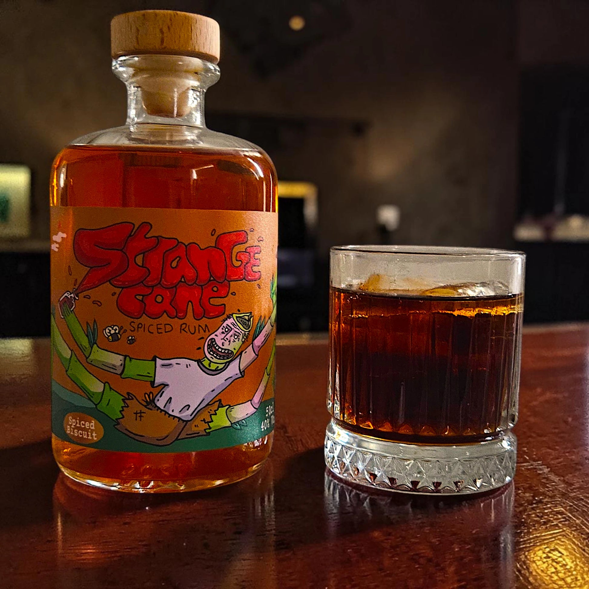 Strange Cane Spiced Biscuit spiced rum served in a glass with cola